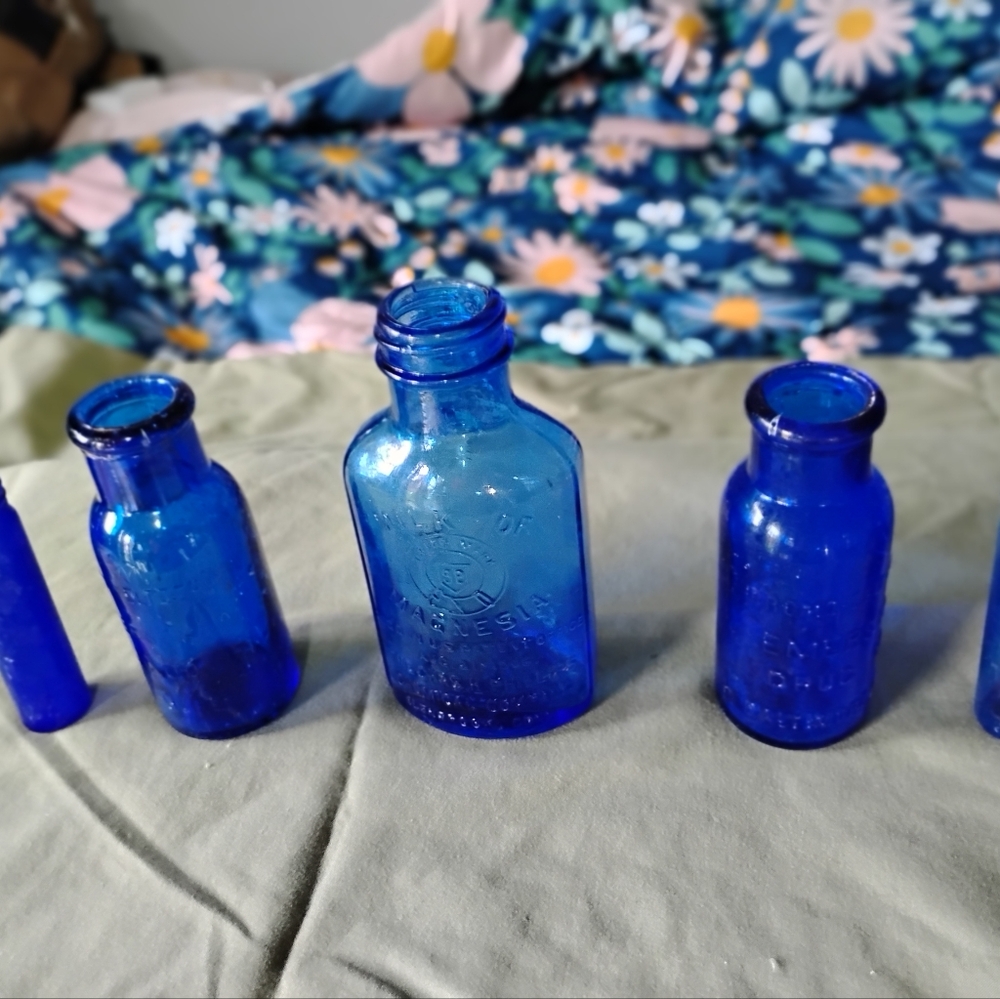 Collection of five cobalt blue vintage miniature bottles